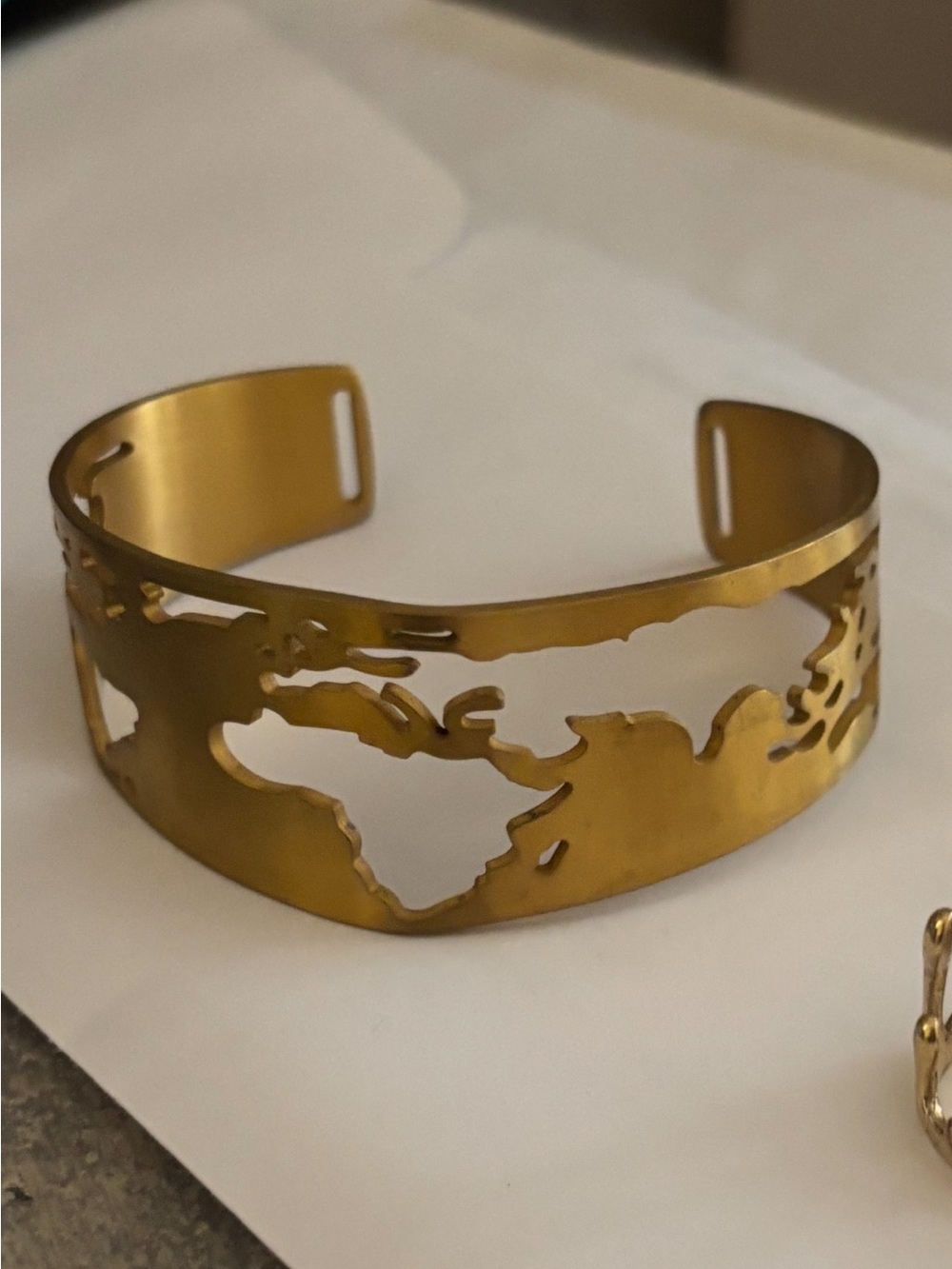 Gold World Map Cutout Cuff Bracelet